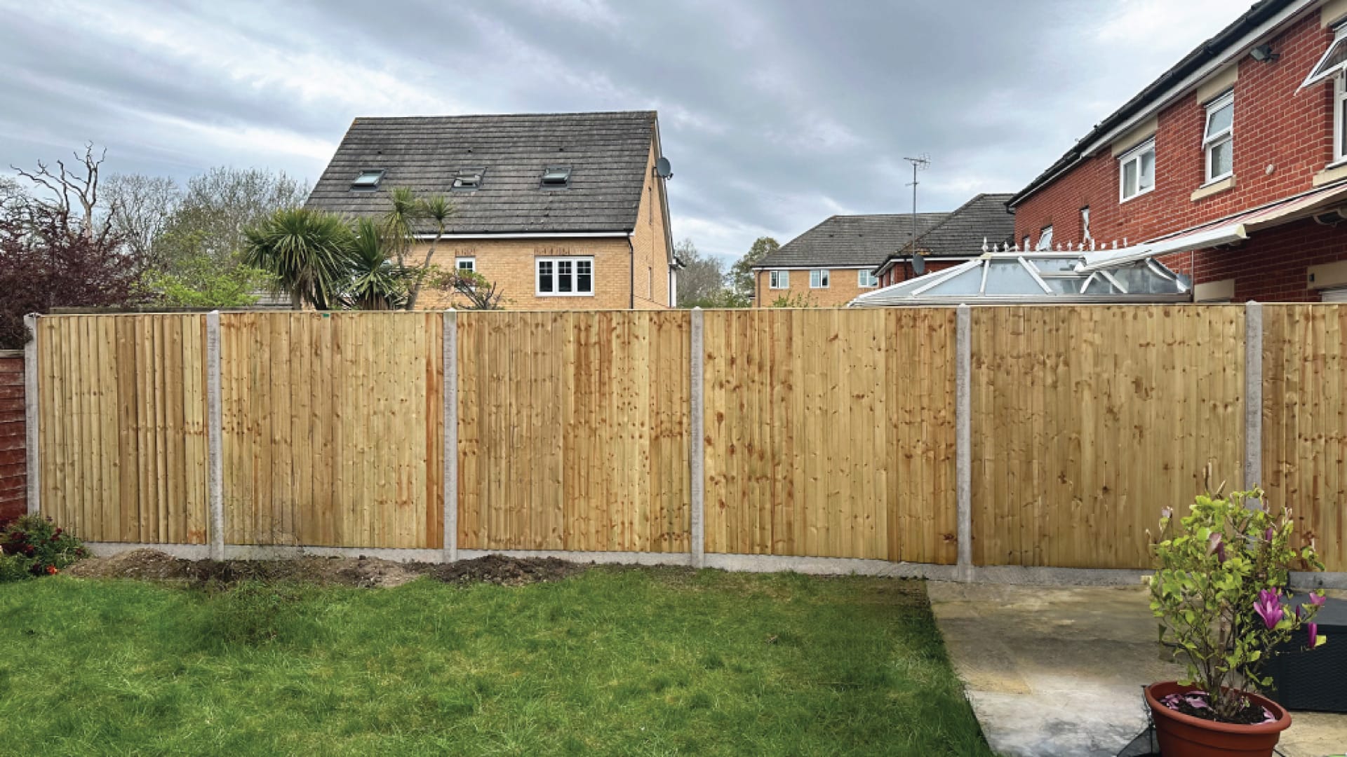 Close-board timber fencing installation in a Surrey garden by Next Fence